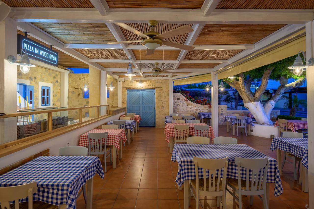 Mythos Suites Hotel ตีกากี ภายนอก รูปภาพ