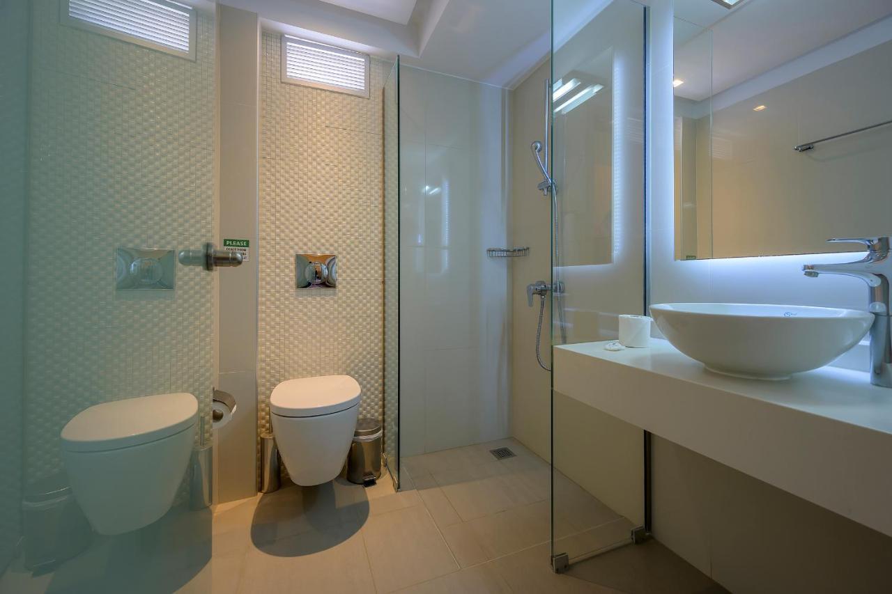 Mythos Suites Hotel ตีกากี ภายนอก รูปภาพ