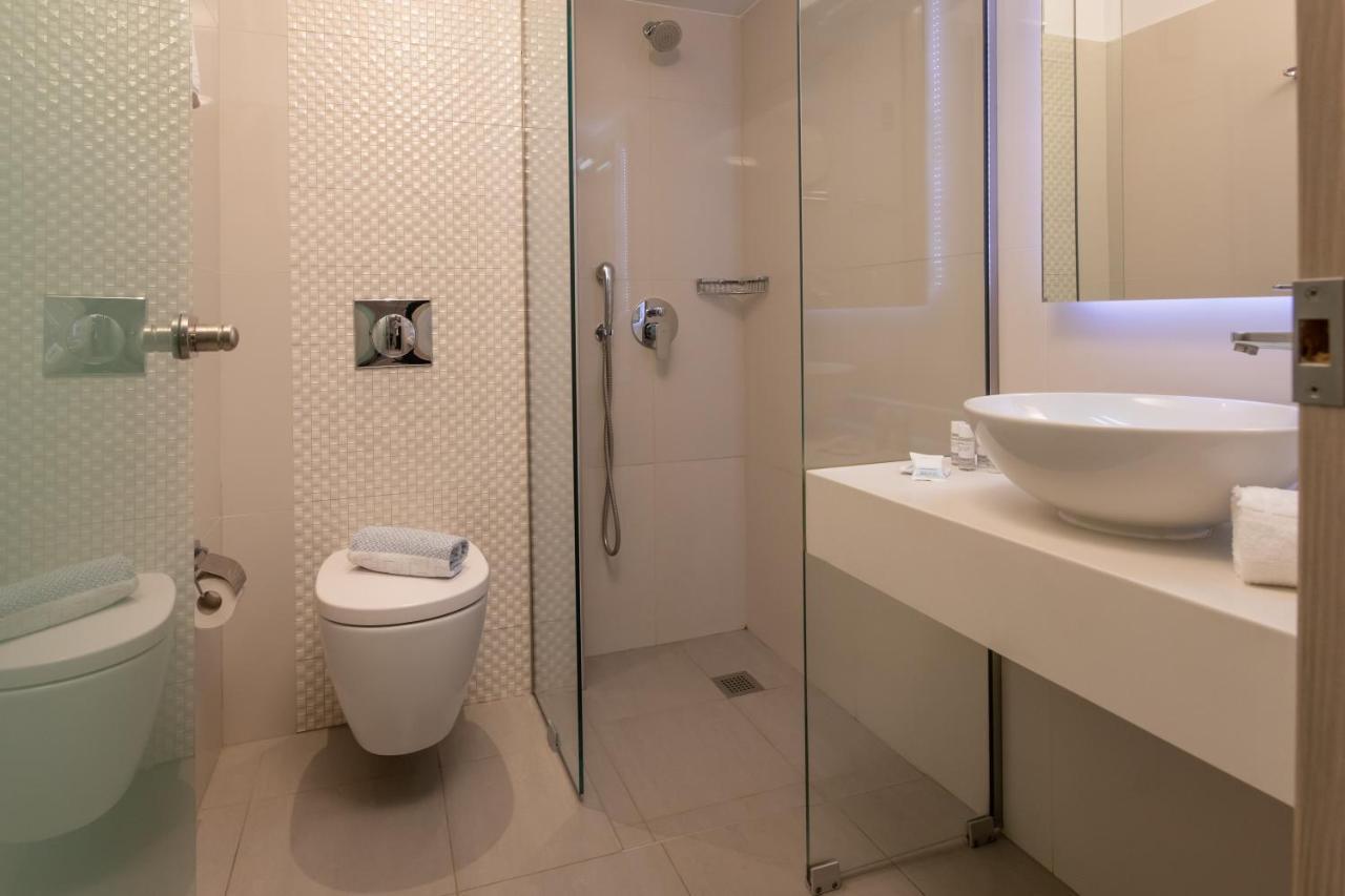 Mythos Suites Hotel ตีกากี ภายนอก รูปภาพ