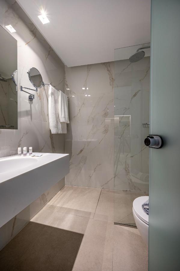 Mythos Suites Hotel ตีกากี ภายนอก รูปภาพ