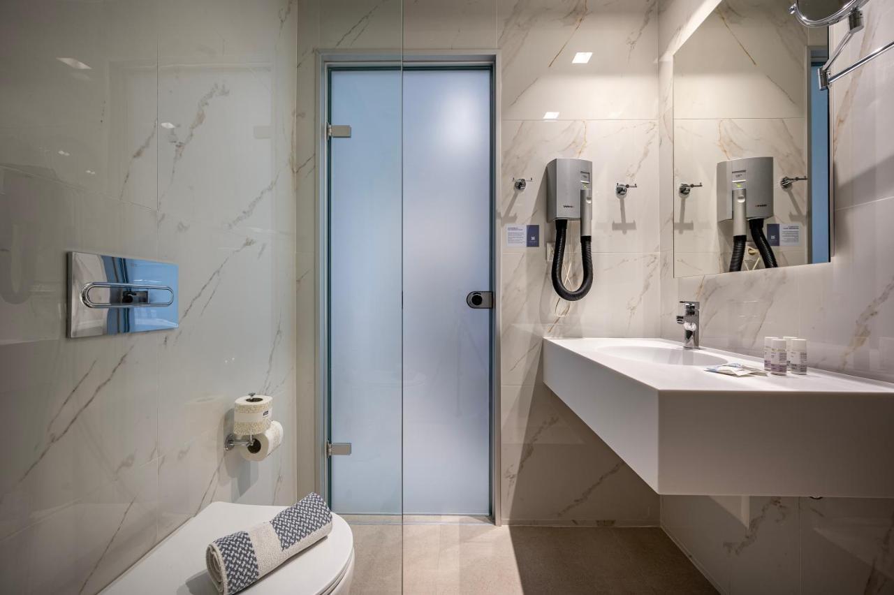 Mythos Suites Hotel ตีกากี ภายนอก รูปภาพ