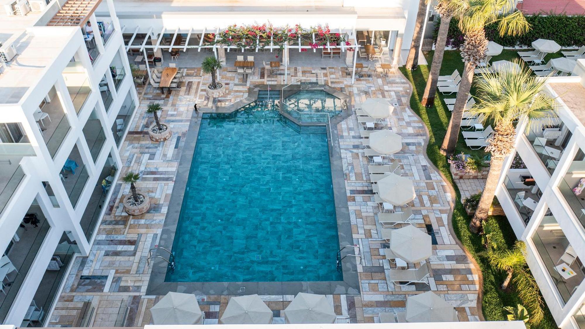 Mythos Suites Hotel ตีกากี ภายนอก รูปภาพ